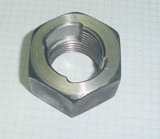 Nut with threads milled away for interrupted screw arrangement.