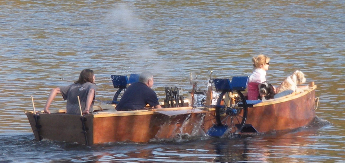 Lookout-Wife Katharine, with our two Tibetan Terriers in the bow, Son Jeanpaul at the stern, and Fred tending the machinery, First Outing